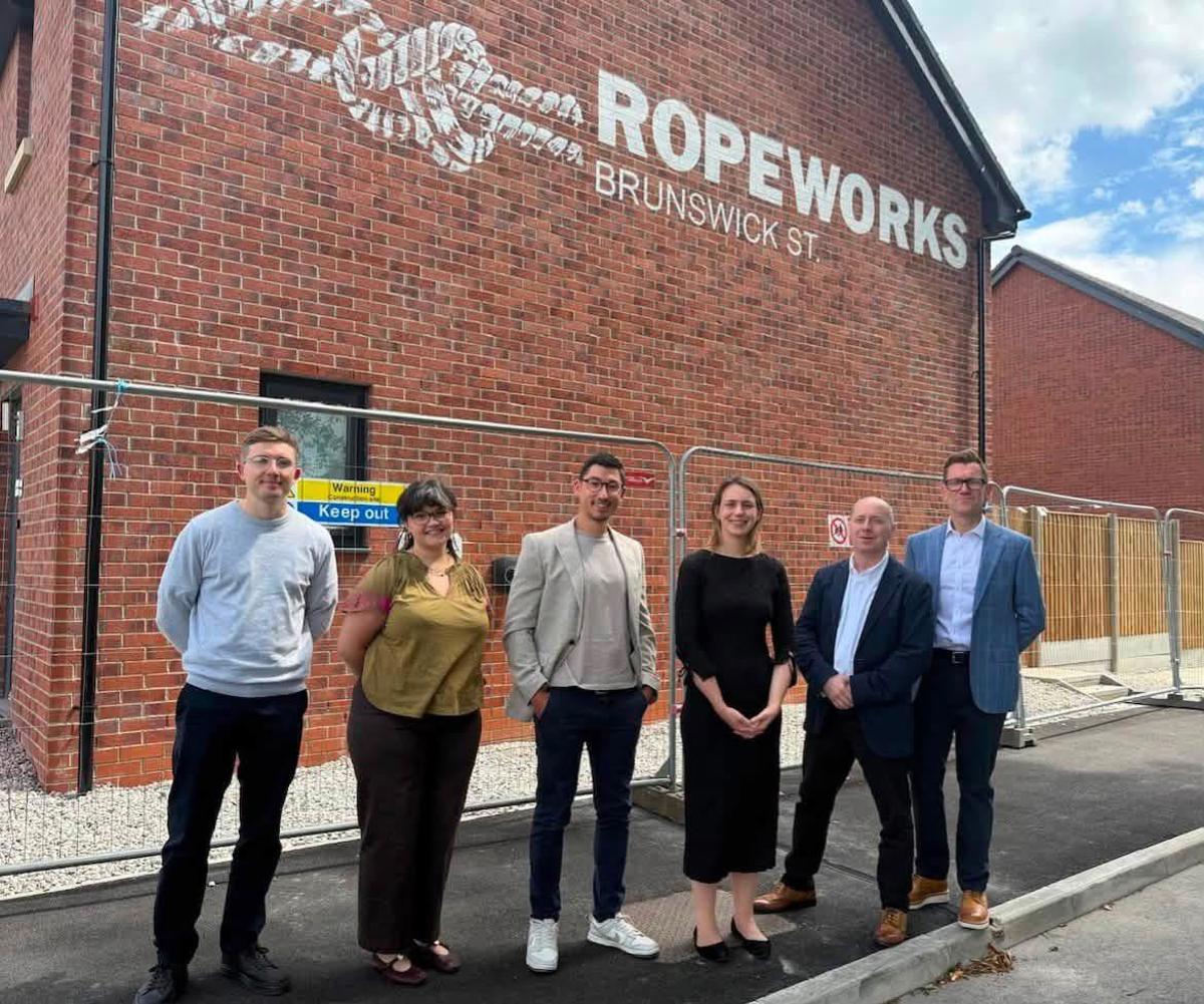 The project team and local MP outside the Ropeworks development in Heywood